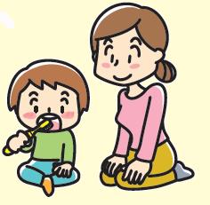 子供の歯みがきは床に座って、保護者の見守りの中で